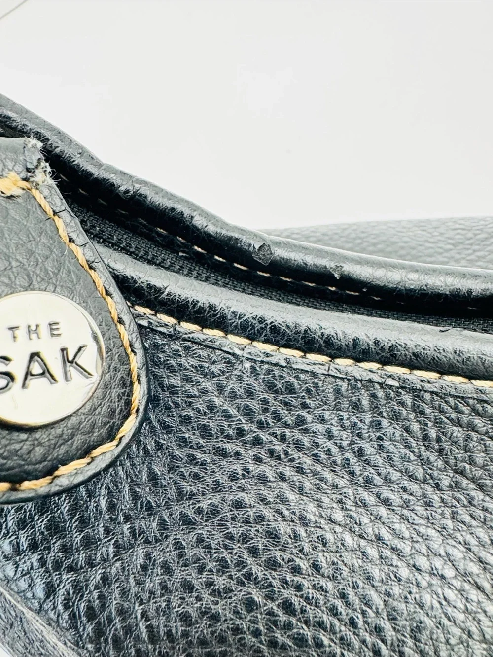 The Sak Baggett hobo. Pebbled leather. Silver-tone hardware. Slouchy Y2K style